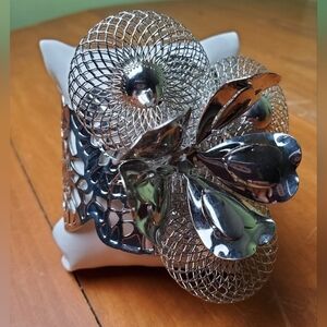 Bracelet, silver toned flower statement piece